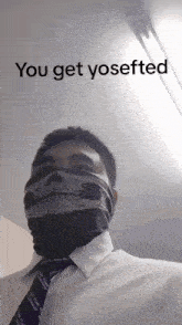 a man wearing a bandana with a skull on it and the words " you get yosefted " above him