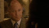 a man in a suit and tie with the words i 'm fascinated behind him