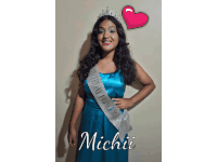 michii is wearing a blue dress and a sash that says birthday princess