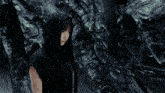 a blurry picture of a woman 's face and hand