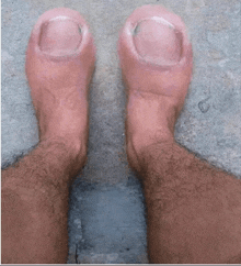 a pair of feet with very long nails and hair