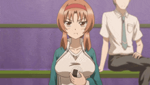 a girl with an angry look on her face is holding a rice ball