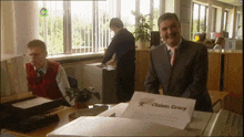 a man in a suit and tie holds a piece of paper that says claims cracy