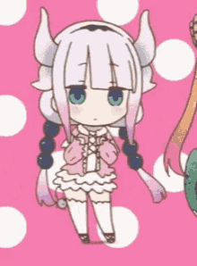 a little girl with horns is standing in front of a pink background .