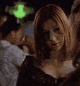 a woman with red hair says leaving now in a dark room