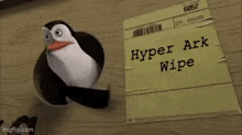 a penguin is holding a piece of paper that says hyper ark wipe .