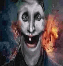 a close up of a person 's face with a big smile on it 's face .