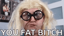 a man wearing glasses and a blonde wig is making a funny face .