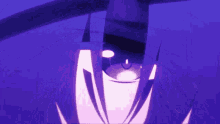 a close up of a person 's eyes with purple hair