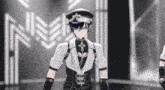 a black and white animated character is standing on a stage .