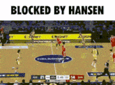 a basketball game is being played on a court with the words blocked by hansen