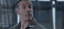 a man is making a funny face and saying `` why '' .