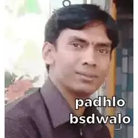 a man in a purple shirt is making a funny face with the words padhlo bsdwalo on his face .