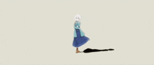 a girl in a blue dress is standing next to a black object