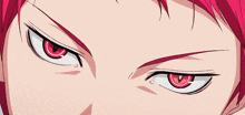 a close up of a person 's face with red eyes