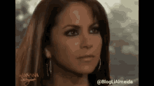 a close up of a woman 's face with the hashtag @blogliaalmeida on the bottom