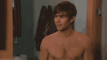 a shirtless man is standing in a doorway with the caption " fuckyeaheverythinggossipgirl " above him