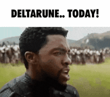a man with a beard is standing in front of a crowd of people and says deltarune today .
