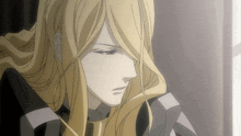 a man with long blonde hair and a black and white striped shirt