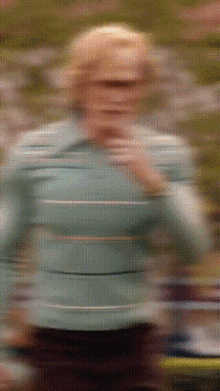 a blurry picture of a person wearing sunglasses