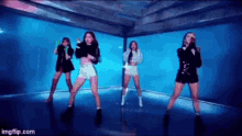 a group of women are standing next to each other on a stage .