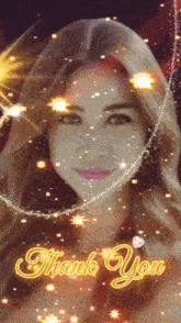a woman 's face is surrounded by sparks and the words thank you