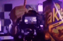 a camera is being used to take a picture of a box of takis