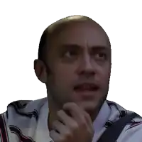 a close up of a man 's face with a striped shirt on