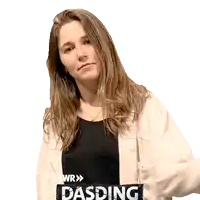 a woman wearing a white jacket and a black shirt with dasding written on it