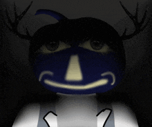 a blue pumpkin with antlers and a smile on it 's face