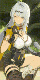a woman with a bird in her hand is sitting on the ground