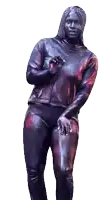 a statue of a woman covered in purple and red paint