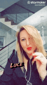 a woman is wearing headphones and has the word luce written on her face