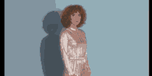 a woman with curly hair is wearing a silver dress and standing in front of a blue wall .