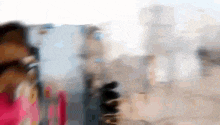 a blurry picture of a person walking down a street