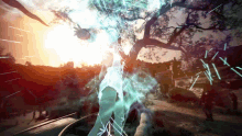 a woman in a white dress is standing in front of a tree with the sun behind her