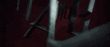 a close up of a metal object on a red background with the word love written on it .
