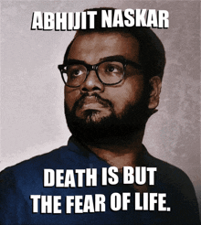 a picture of a man with glasses and the words death is but the fear of life below him
