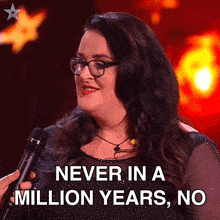 a woman with glasses is holding a microphone and says " never in a million years "