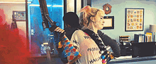harley quinn is carrying a gun on her back while standing next to a man .