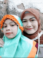 a woman and a little girl pose for a picture with pixverse.ai in the background