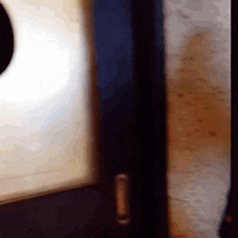 a blurred image of a door with a hole in the middle