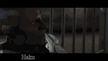 a man is walking down a street at night with a gun in his hand .