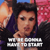 a drag queen says we 're gonna have to start while wearing feathers