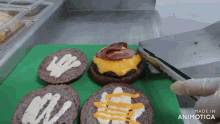 a green cutting board with a bunch of food on it and the words made in animotica on the bottom