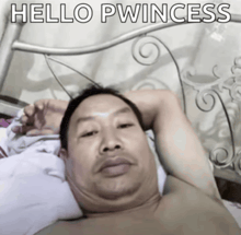 a shirtless man laying on a bed with the words hello pwincess written above him