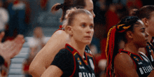 a female basketball player wearing a jersey that says belen on it