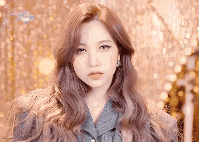 a close up of a woman with long brown hair