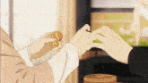 a person holding a piece of food in their hands