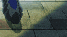 a person is walking on a tiled floor